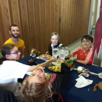 Kids at Gryffindor house table in Great Hall